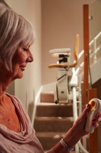 woman using stair lift control