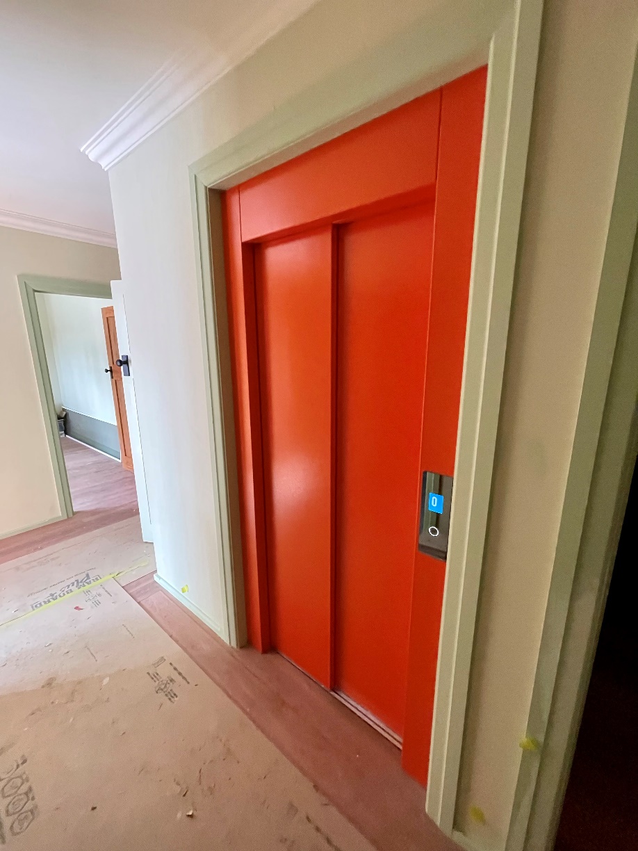 An orange home elevator.