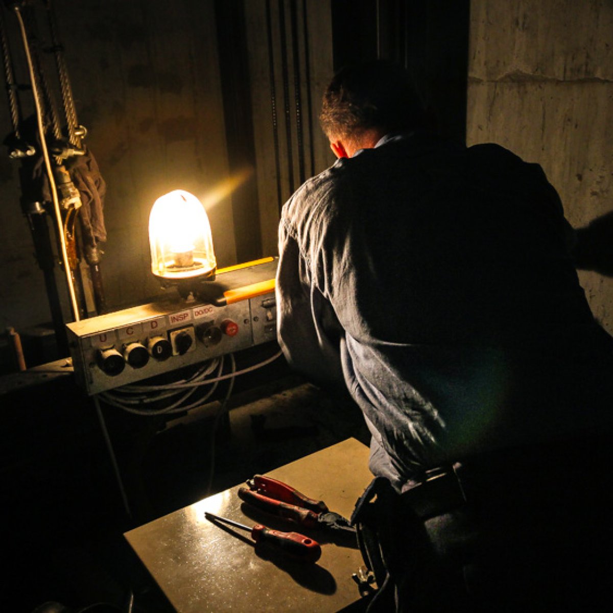 An elevator technician working in a shaft Maintenance | Simplex Elevators Gallery Image 6